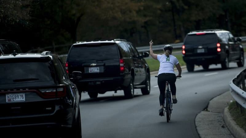 Cyclist Flipping Off Donald Trump's Motorcade meme template - Cyclist Flipping Off Trump