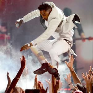 Miguel's Fan-Kicking Stage Dive meme template - Miguel Stage Dive