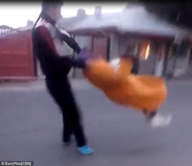 Romanian Thug Swings Elderly Woman meme template - Romanian Thug Swings Elderly Woman